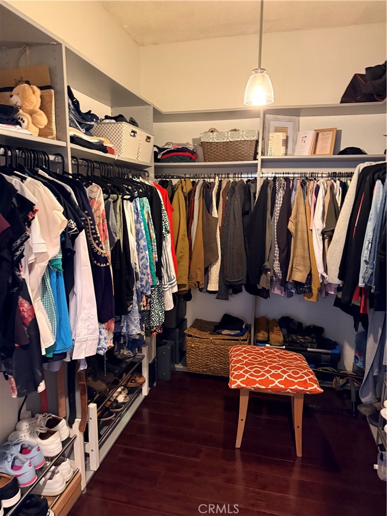 14630 Dickens Street, Unit 307 Sherman Oaks, CA 91403 - Photo 30 of 41 a view of walk in closet with clothes and shoes