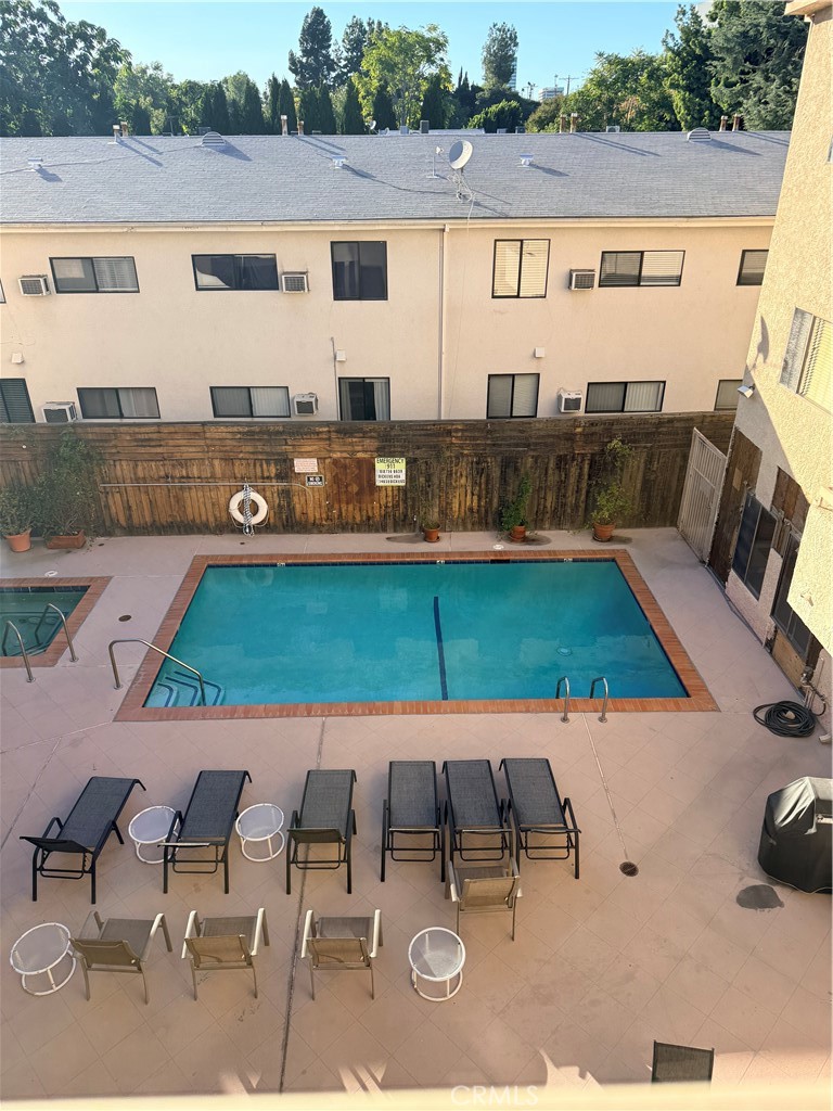 14630 Dickens Street, Unit 307 Sherman Oaks, CA 91403 - Photo 6 of 41 swimming pool with outdoor seating and yard