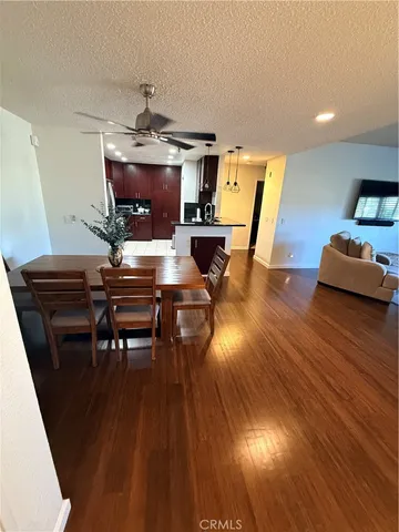 a kitchen with stainless steel appliances a refrigerator sink and microwave