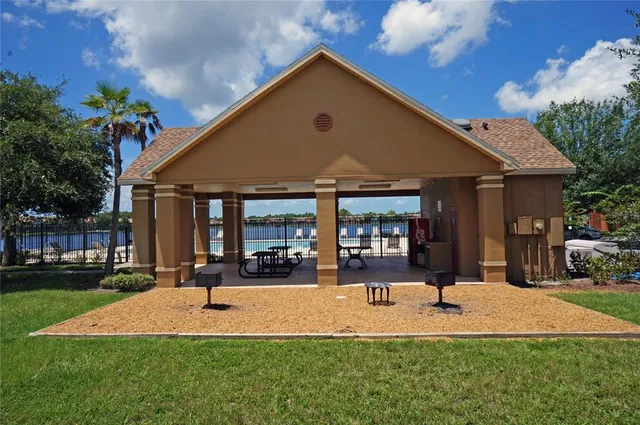 a view of a lake with houses in the back