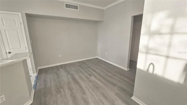 a view of small space with wooden floor