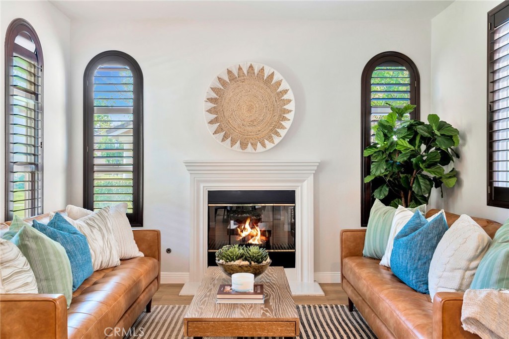 8 Caltrop Way Ladera Ranch, CA 92694 - Photo 1 of 1 a living room with furniture and a fireplace