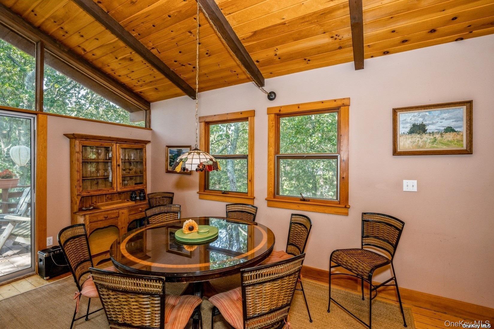 292 Little Fresh Pond Road Southampton, NY 11968 - Photo 16 of 46 a dining room with furniture and windows