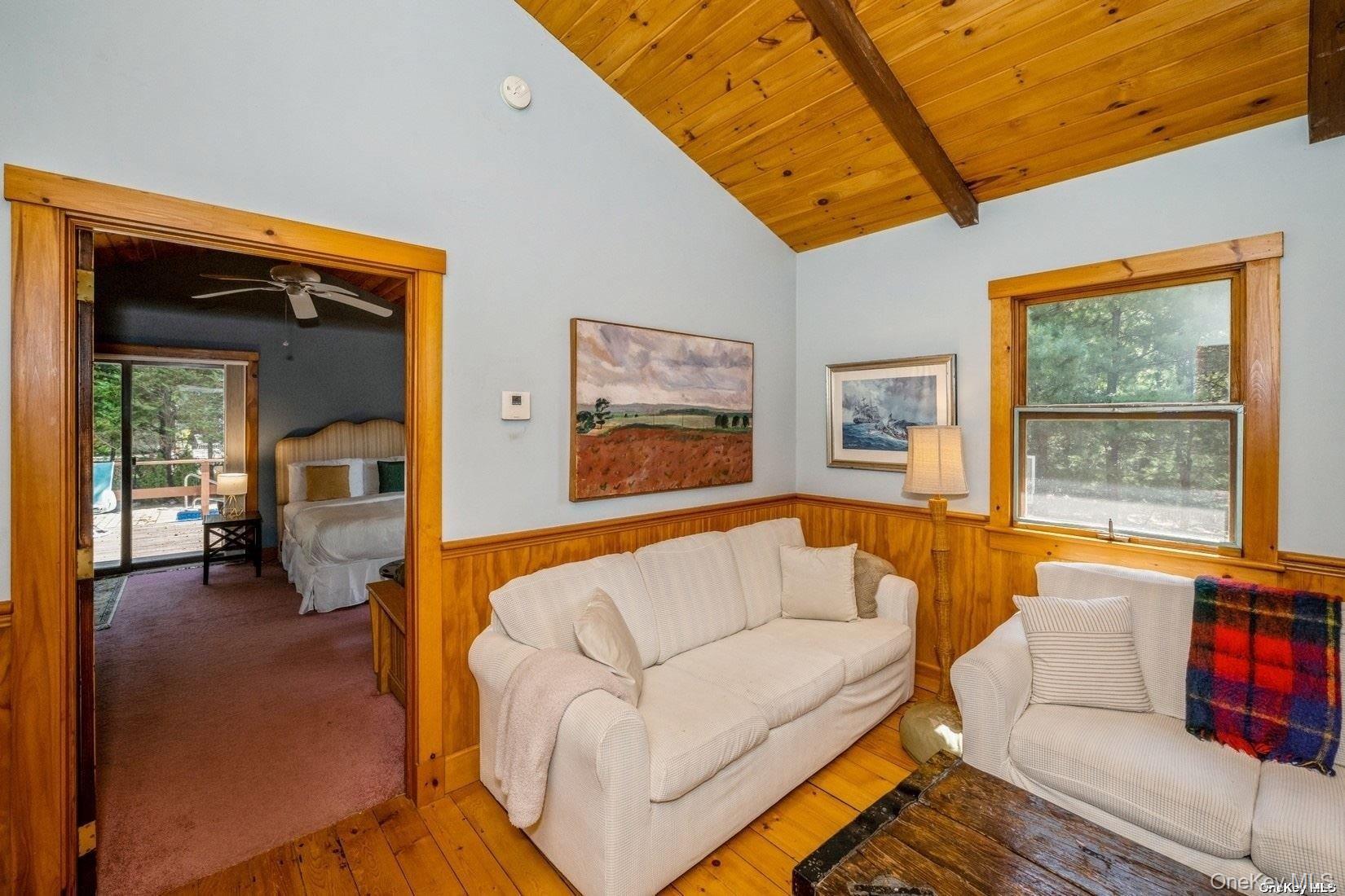 292 Little Fresh Pond Road Southampton, NY 11968 - Photo 23 of 46 a living room with furniture and a large window