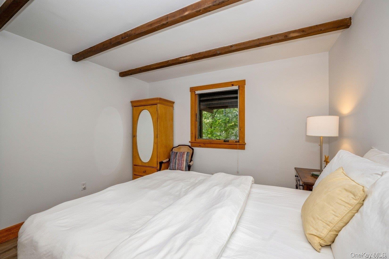 292 Little Fresh Pond Road Southampton, NY 11968 - Photo 30 of 46 a bedroom with a bed and a window