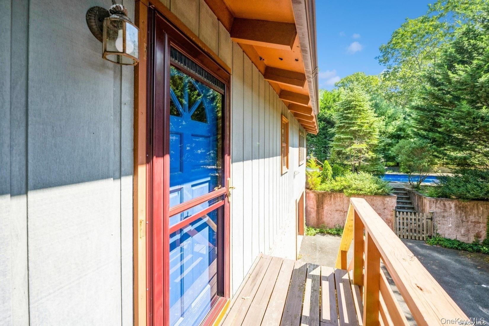 292 Little Fresh Pond Road Southampton, NY 11968 - Photo 41 of 46 a view of balcony with wooden floor and fence