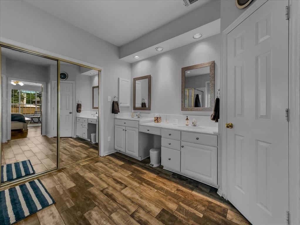 6206 Hidden Springs Lane Garland, TX 75044 - Photo 11 of 24 Ensuite bathroom featuring double vanity, recessed lighting, and wood finished floors