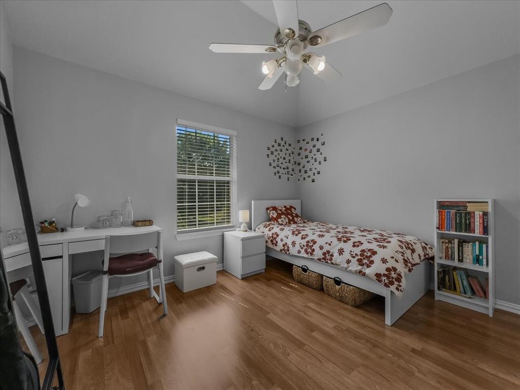 6206 Hidden Springs Lane Garland, TX 75044 - Photo 17 of 24 Bedroom with wood finished floors, a ceiling fan, and baseboards