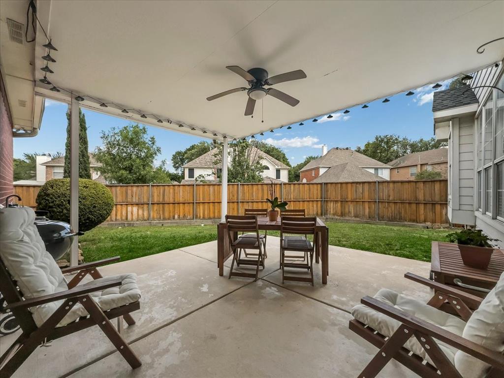 6206 Hidden Springs Lane Garland, TX 75044 - Photo 23 of 24 View of patio featuring outdoor dining area and ceiling fan