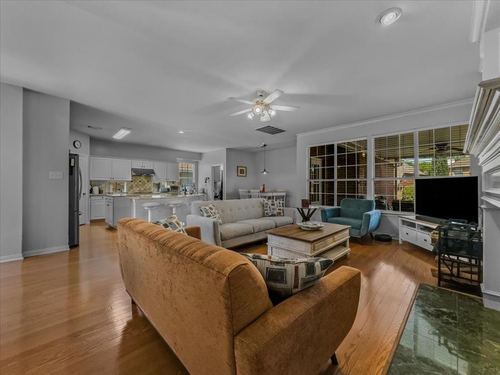 6206 Hidden Springs Lane Garland, TX 75044 - Photo 5 of 24 Living area with light wood-type flooring, ceiling fan, baseboards, and recessed lighting