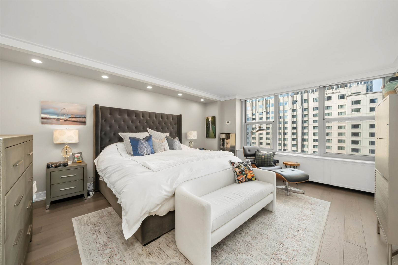 777 North Michigan Avenue, Unit 1601 Chicago, IL 60611 - Photo 17 of 44 a bedroom with a bed couch and a window