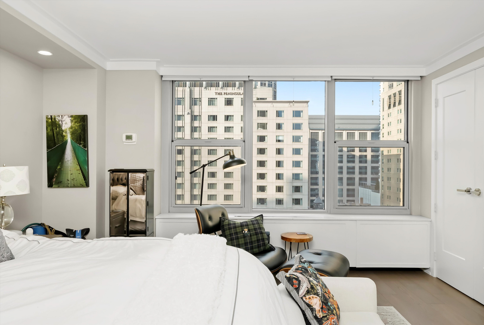 777 North Michigan Avenue, Unit 1601 Chicago, IL 60611 - Photo 18 of 44 a bedroom with a bed and wooden floor