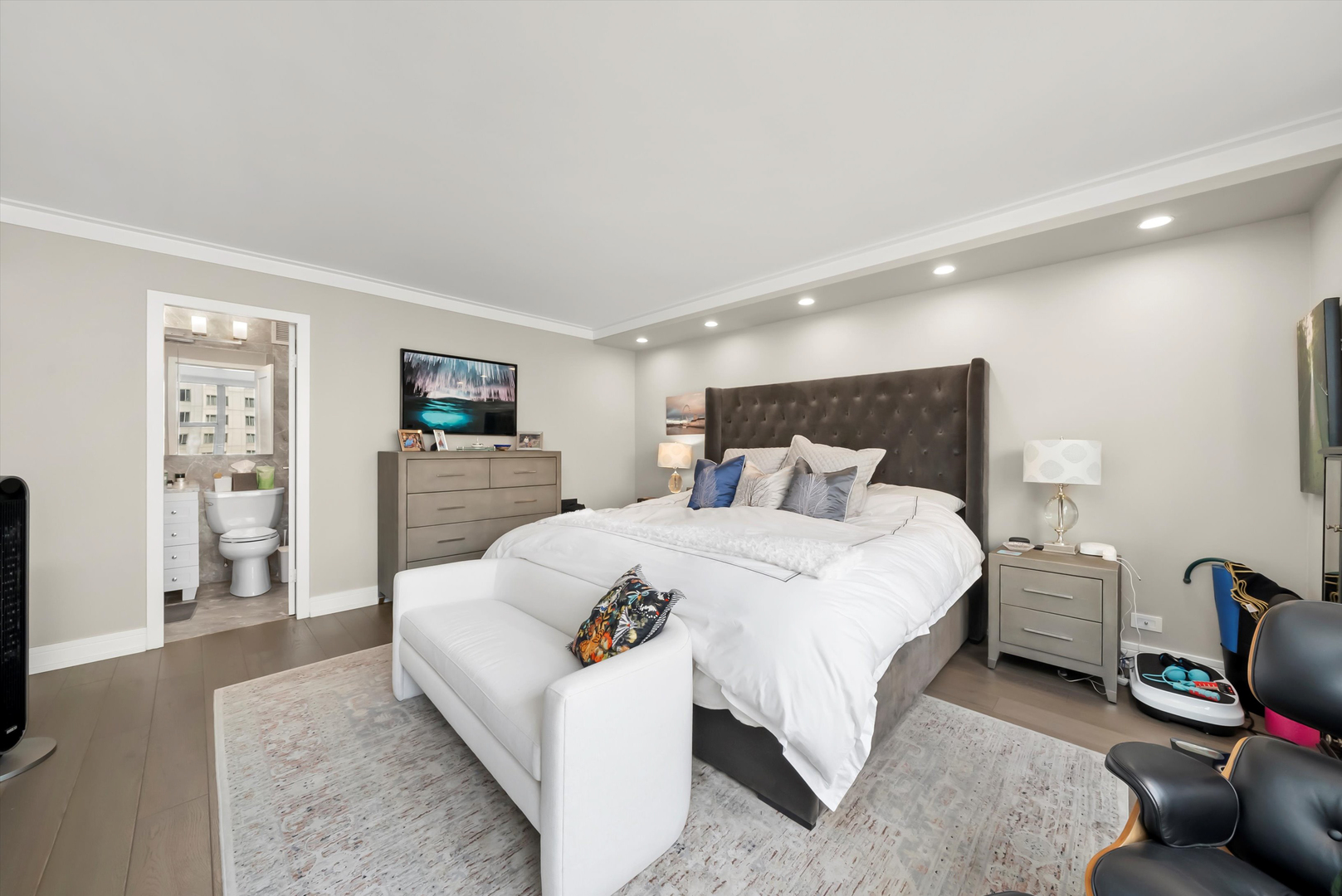 777 North Michigan Avenue, Unit 1601 Chicago, IL 60611 - Photo 19 of 44 a bedroom with a bed and a couch