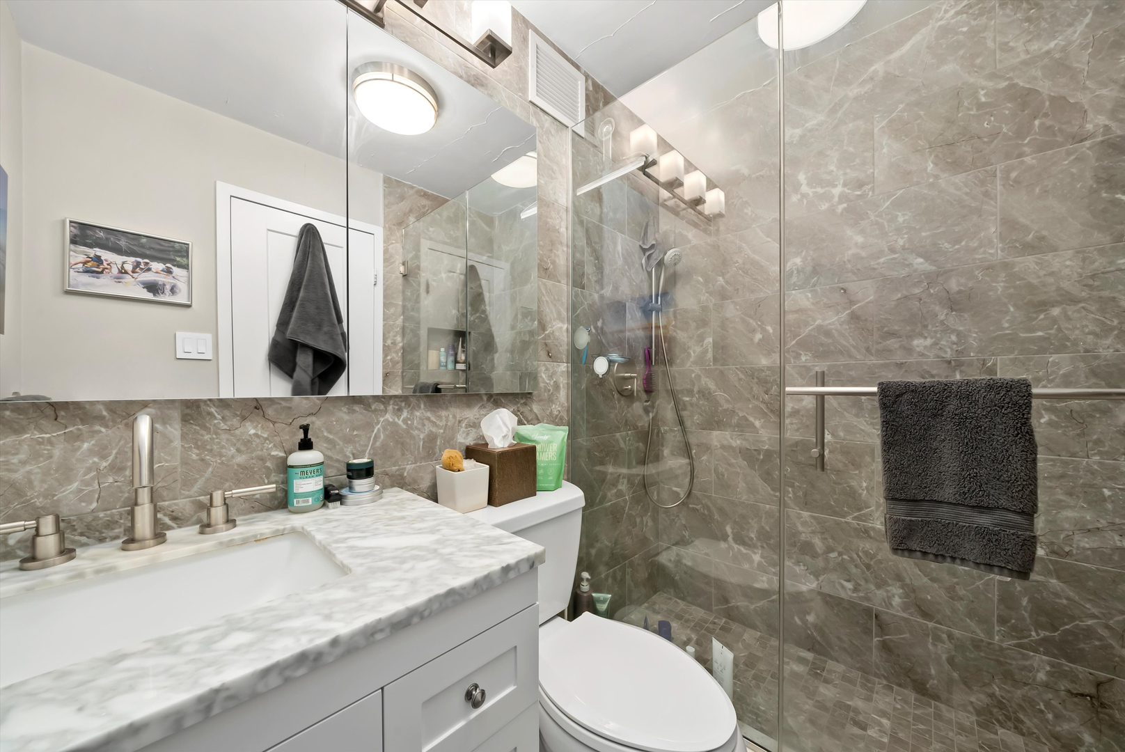 777 North Michigan Avenue, Unit 1601 Chicago, IL 60611 - Photo 25 of 44 a bathroom with a granite countertop sink toilet and shower