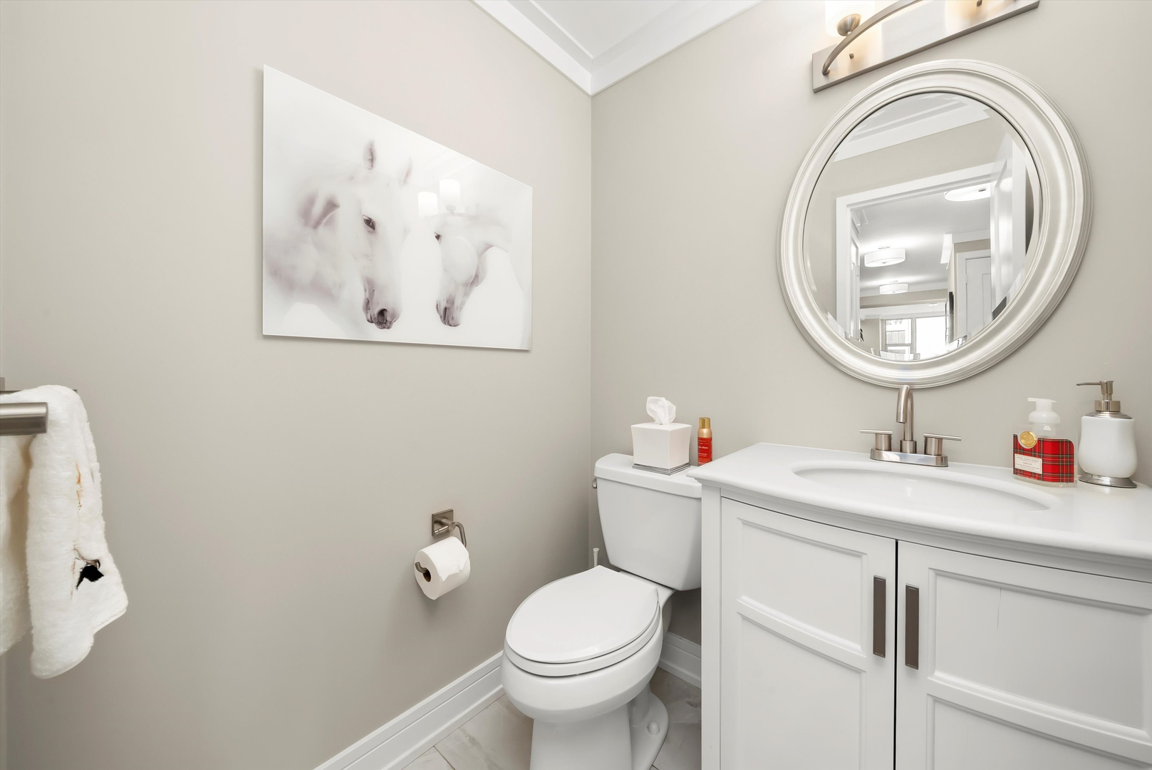 777 North Michigan Avenue, Unit 1601 Chicago, IL 60611 - Photo 27 of 44 a bathroom with a toilet a sink and a mirror