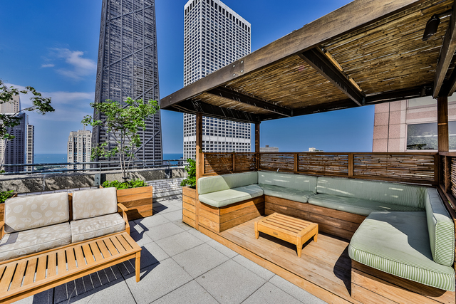 777 North Michigan Avenue, Unit 1601 Chicago, IL 60611 - Photo 35 of 44 a view of a roof deck with couches and potted plants