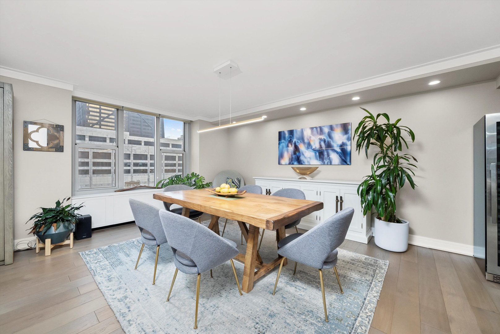 777 North Michigan Avenue, Unit 1601 Chicago, IL 60611 - Photo 6 of 44 a view of a dining room with furniture window and wooden floor