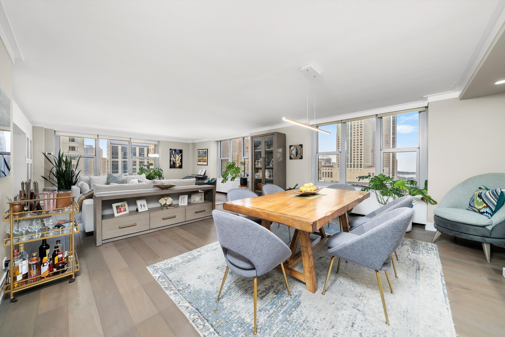 777 North Michigan Avenue, Unit 1601 Chicago, IL 60611 - Photo 7 of 44 a living room with furniture and a table