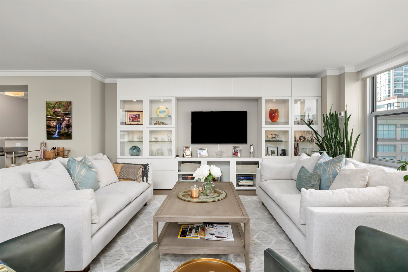 777 North Michigan Avenue, Unit 1601 Chicago, IL 60611 - Photo 9 of 44 a living room with furniture and a flat screen tv