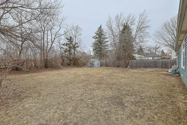 a view of a yard with a house