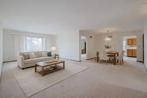 a living room with furniture and a table