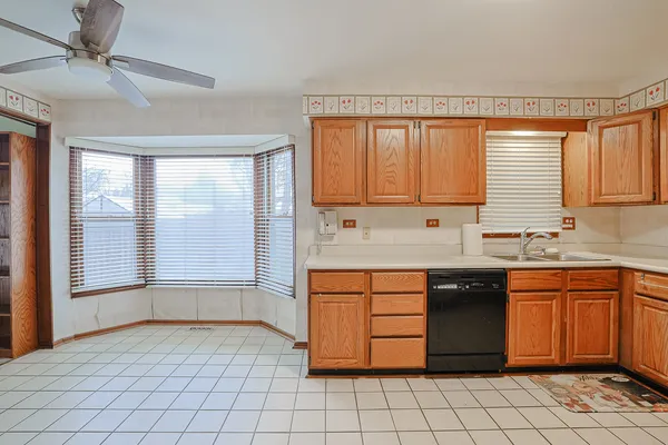 a kitchen with stainless steel appliances granite countertop a sink and cabinets