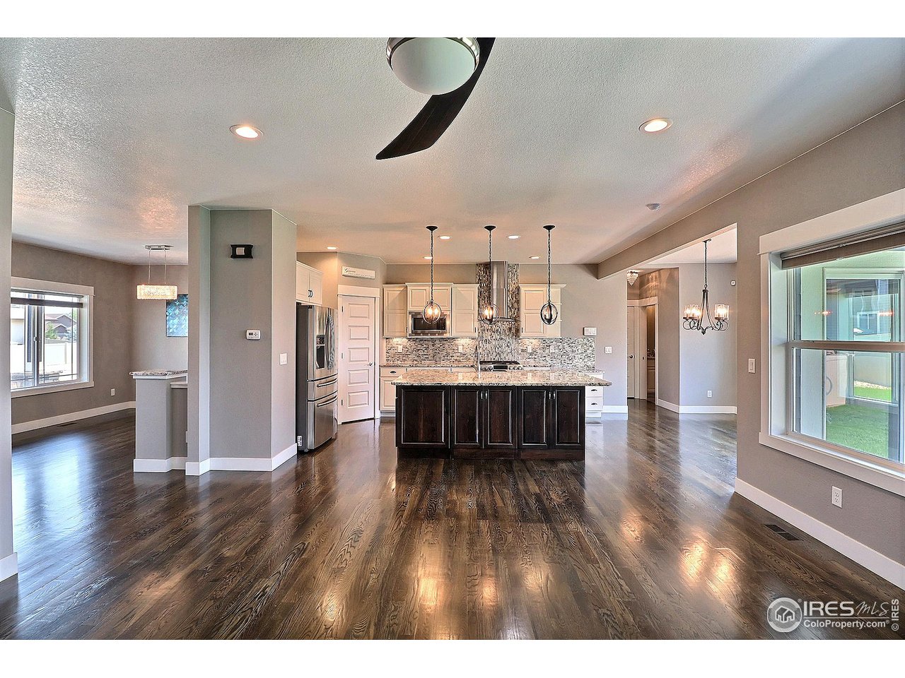 9004 19th Street Greeley, CO 80634 - Photo 11 of 49 a view of kitchen with cabinets and wooden floor