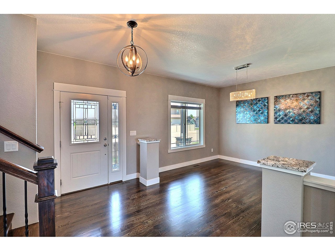 9004 19th Street Greeley, CO 80634 - Photo 2 of 49 a view of an entryway with wooden floor