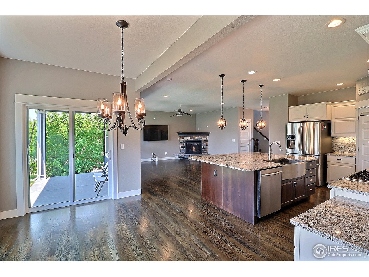 9004 19th Street Greeley, CO 80634 - Photo 21 of 49 a large kitchen with kitchen island a large island in it