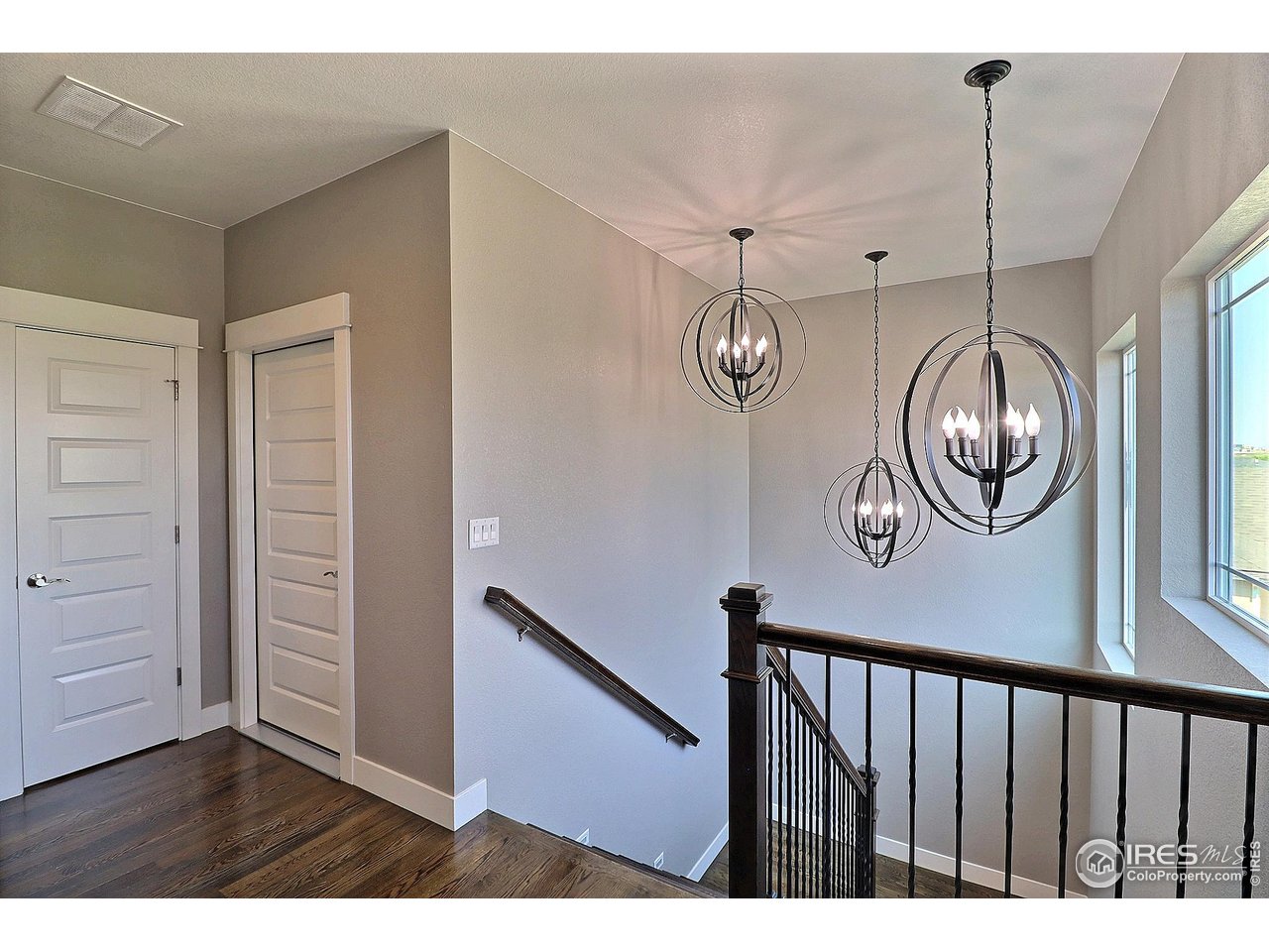9004 19th Street Greeley, CO 80634 - Photo 24 of 49 a view of a hallway with wooden floor