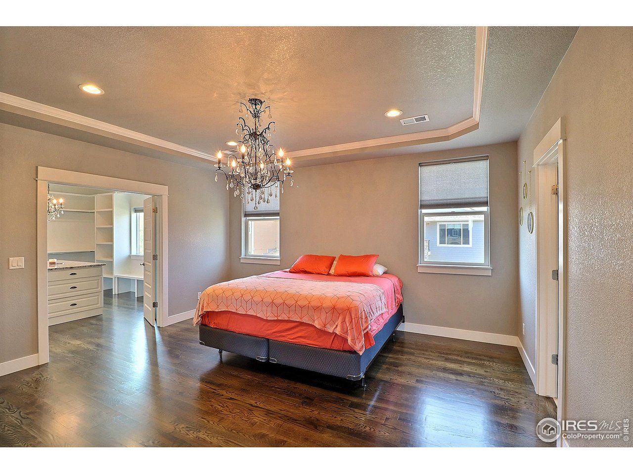 9004 19th Street Greeley, CO 80634 - Photo 25 of 49 a bedroom with a bed and wooden floor
