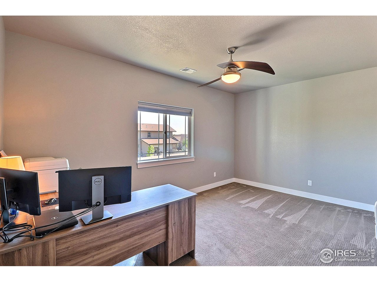 9004 19th Street Greeley, CO 80634 - Photo 30 of 49 a view of an empty room with a window