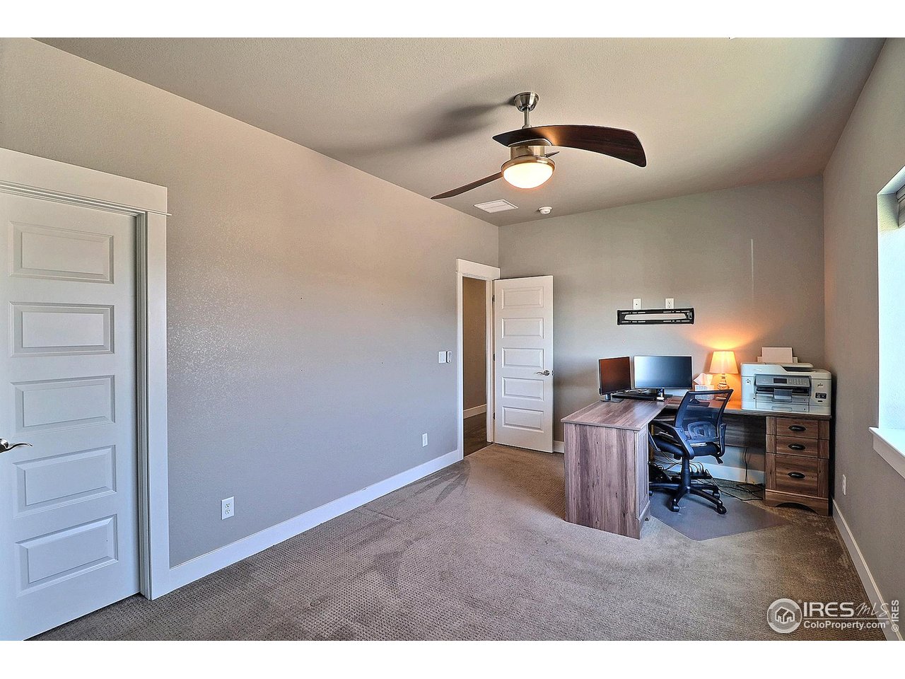 9004 19th Street Greeley, CO 80634 - Photo 31 of 49 a view of a workspace with furniture and a window