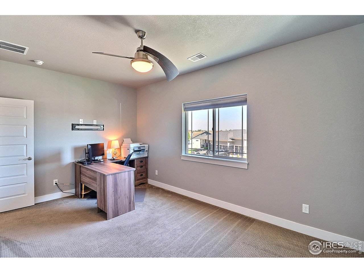 9004 19th Street Greeley, CO 80634 - Photo 32 of 49 a view of a workspace with furniture and a window