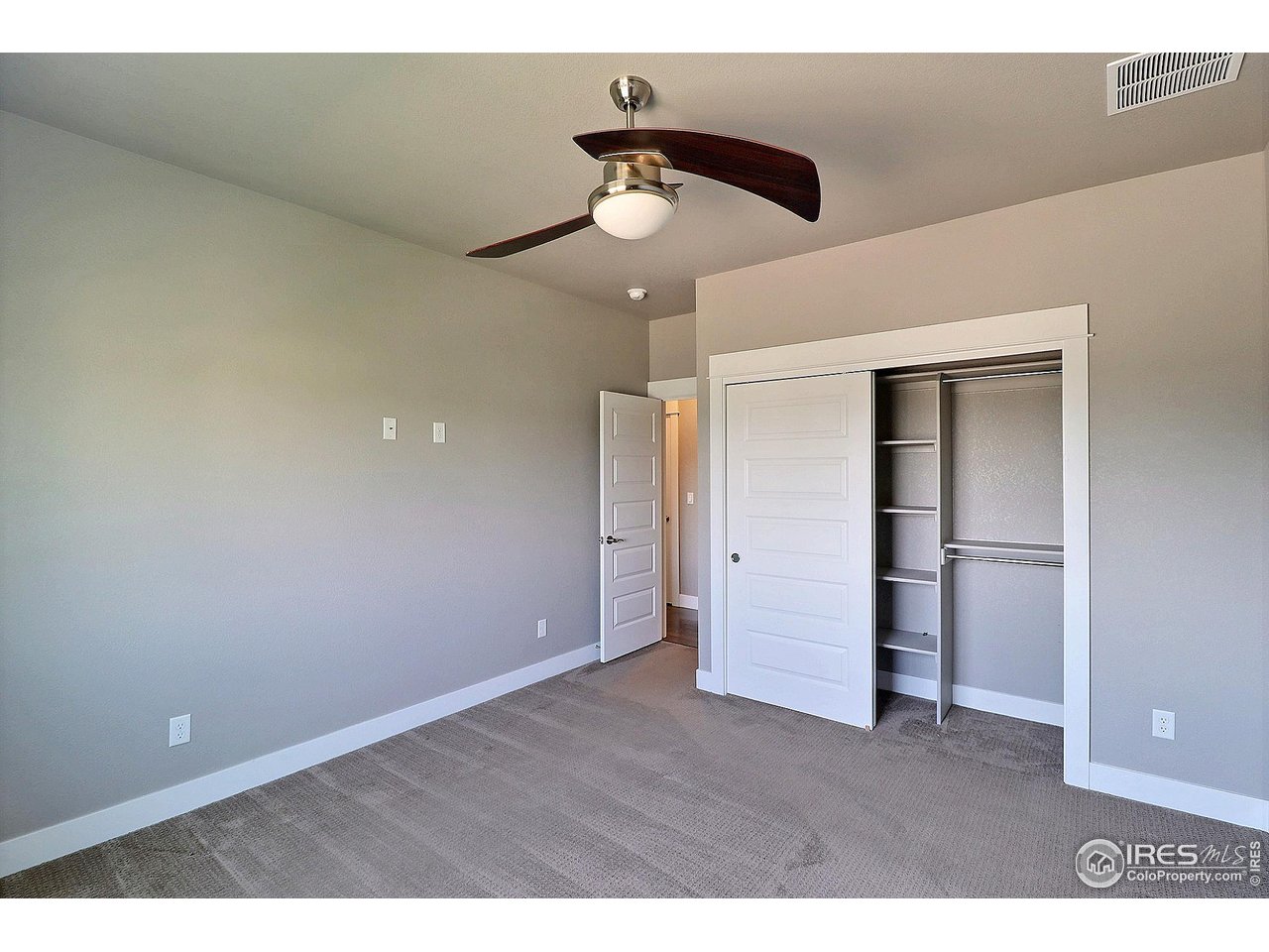 9004 19th Street Greeley, CO 80634 - Photo 34 of 49 a view of empty room with a ceiling fan