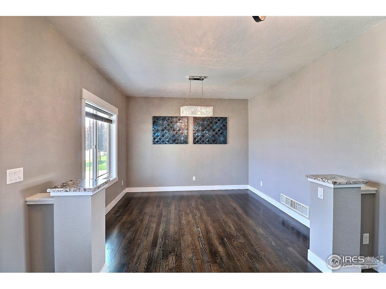 9004 19th Street Greeley, CO 80634 - Photo 4 of 49 a view of an empty room with a window