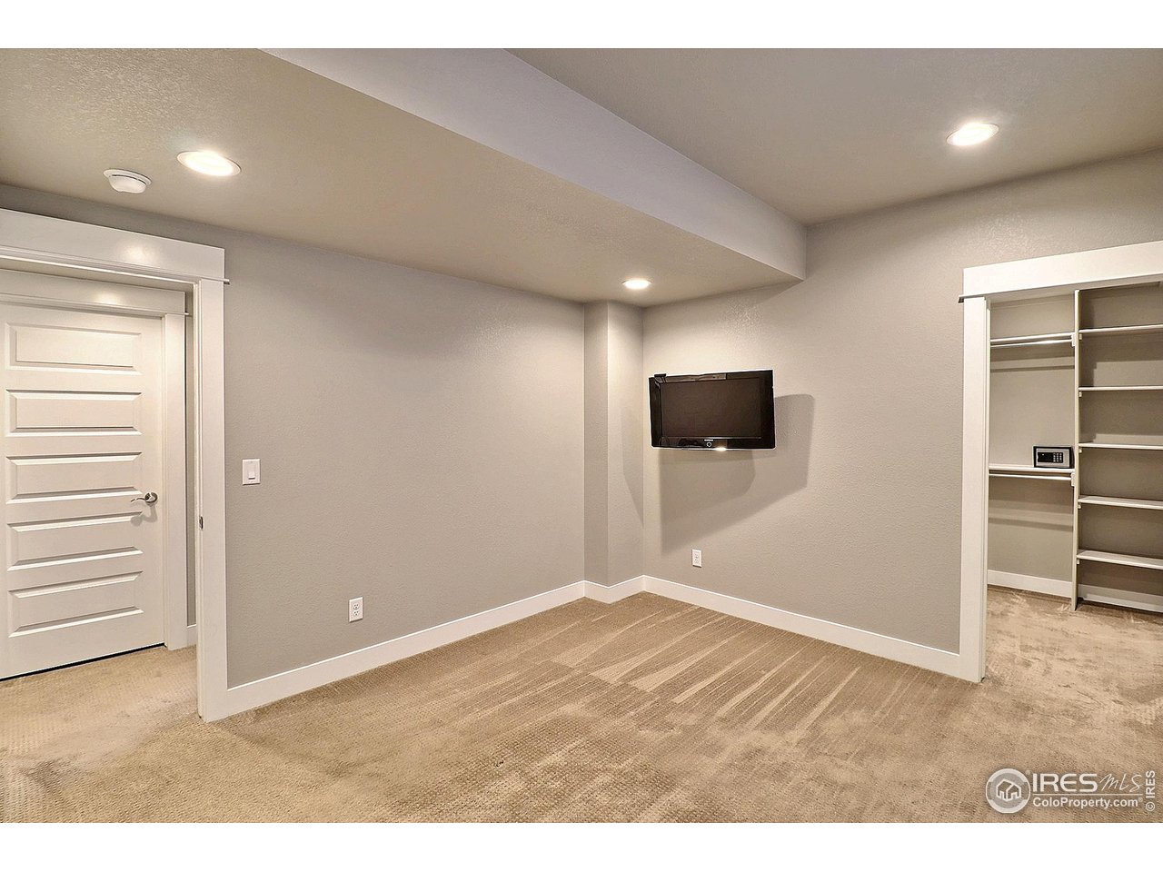 9004 19th Street Greeley, CO 80634 - Photo 42 of 49 a view of an empty room with wooden floor and closet