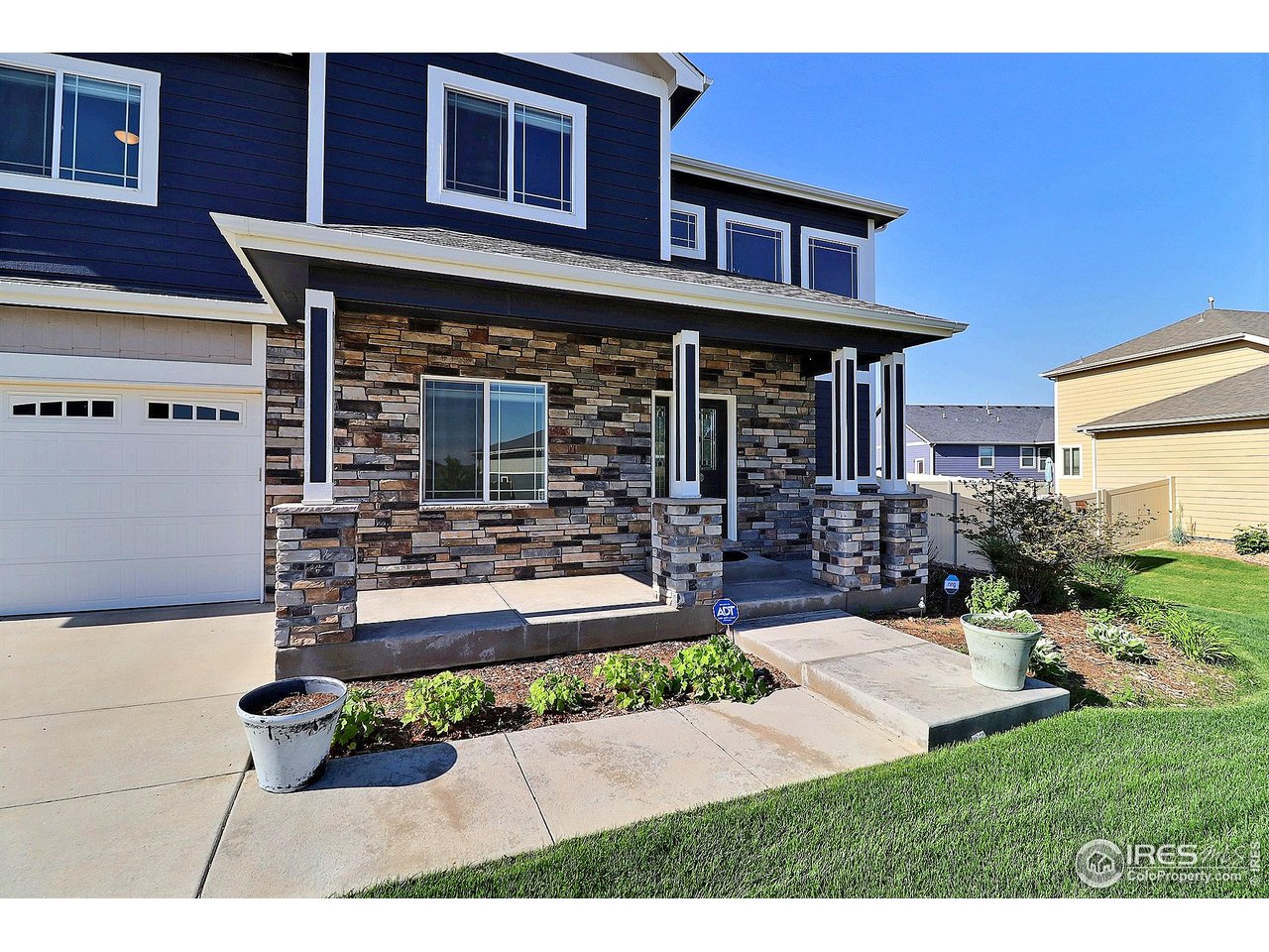 9004 19th Street Greeley, CO 80634 - Photo 49 of 49 a view of a house with backyard and sitting area