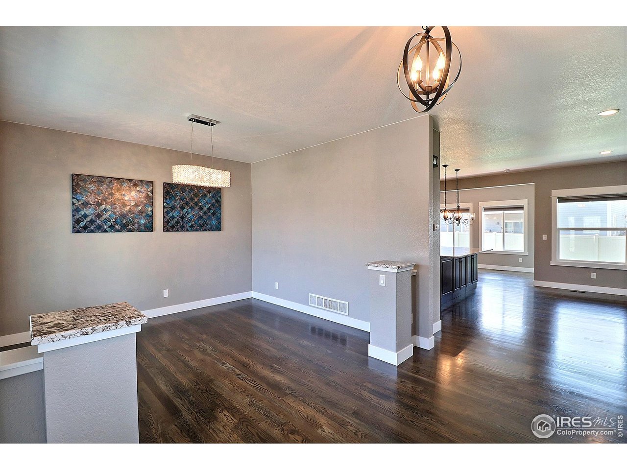 9004 19th Street Greeley, CO 80634 - Photo 5 of 49 a view interior of a house wooden floor and a chandelier