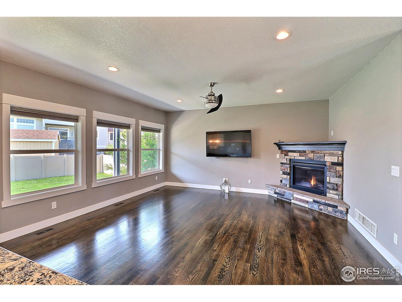 9004 19th Street Greeley, CO 80634 - Photo 8 of 49 a living room with furniture and a flat screen tv