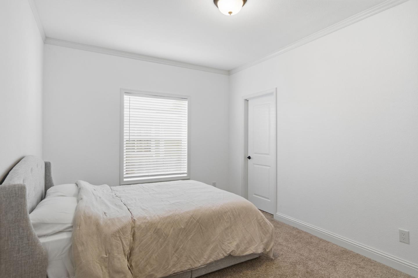 1842 Quimby Road, Unit 1842 San Jose, CA 95122 - Photo 16 of 25 a bedroom with a bed and a window