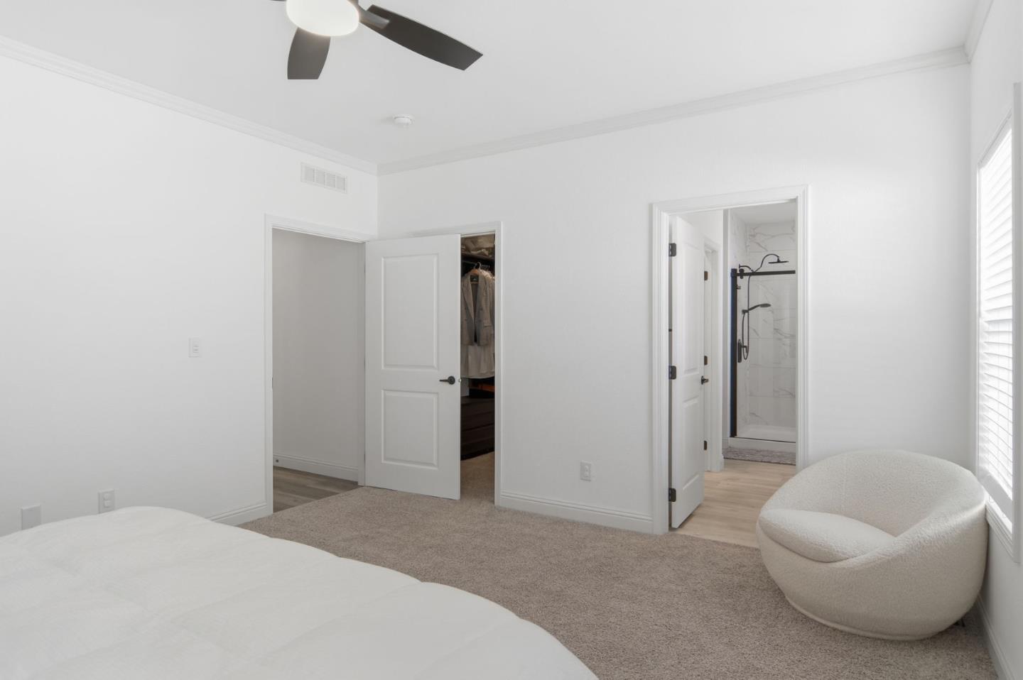1842 Quimby Road, Unit 1842 San Jose, CA 95122 - Photo 20 of 25 a spacious bedroom with a bed and a chandelier