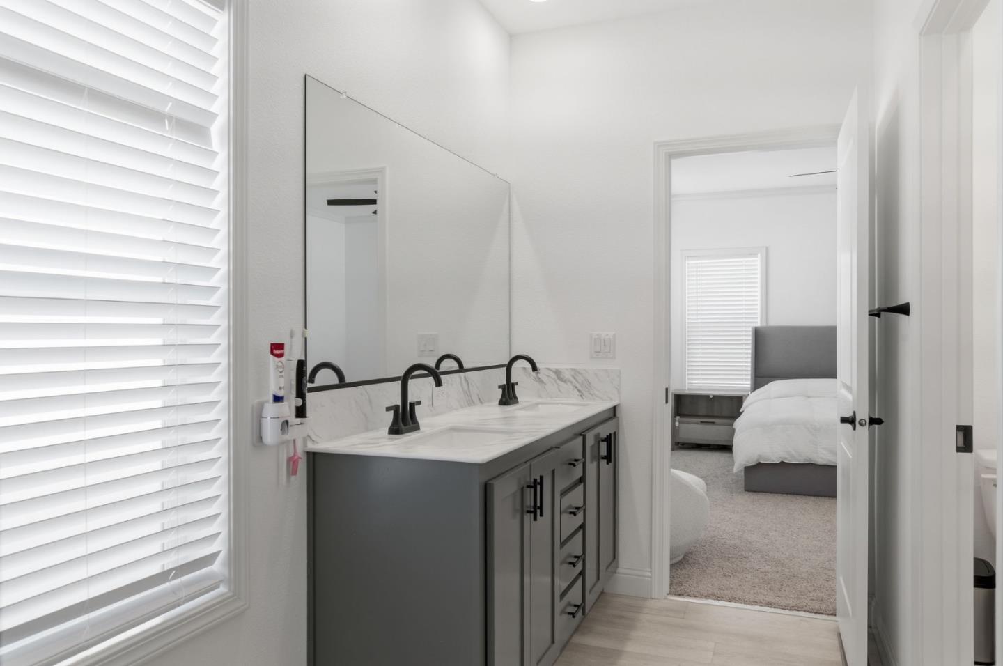 1842 Quimby Road, Unit 1842 San Jose, CA 95122 - Photo 24 of 25 a en suite bathroom with a sink and a mirror