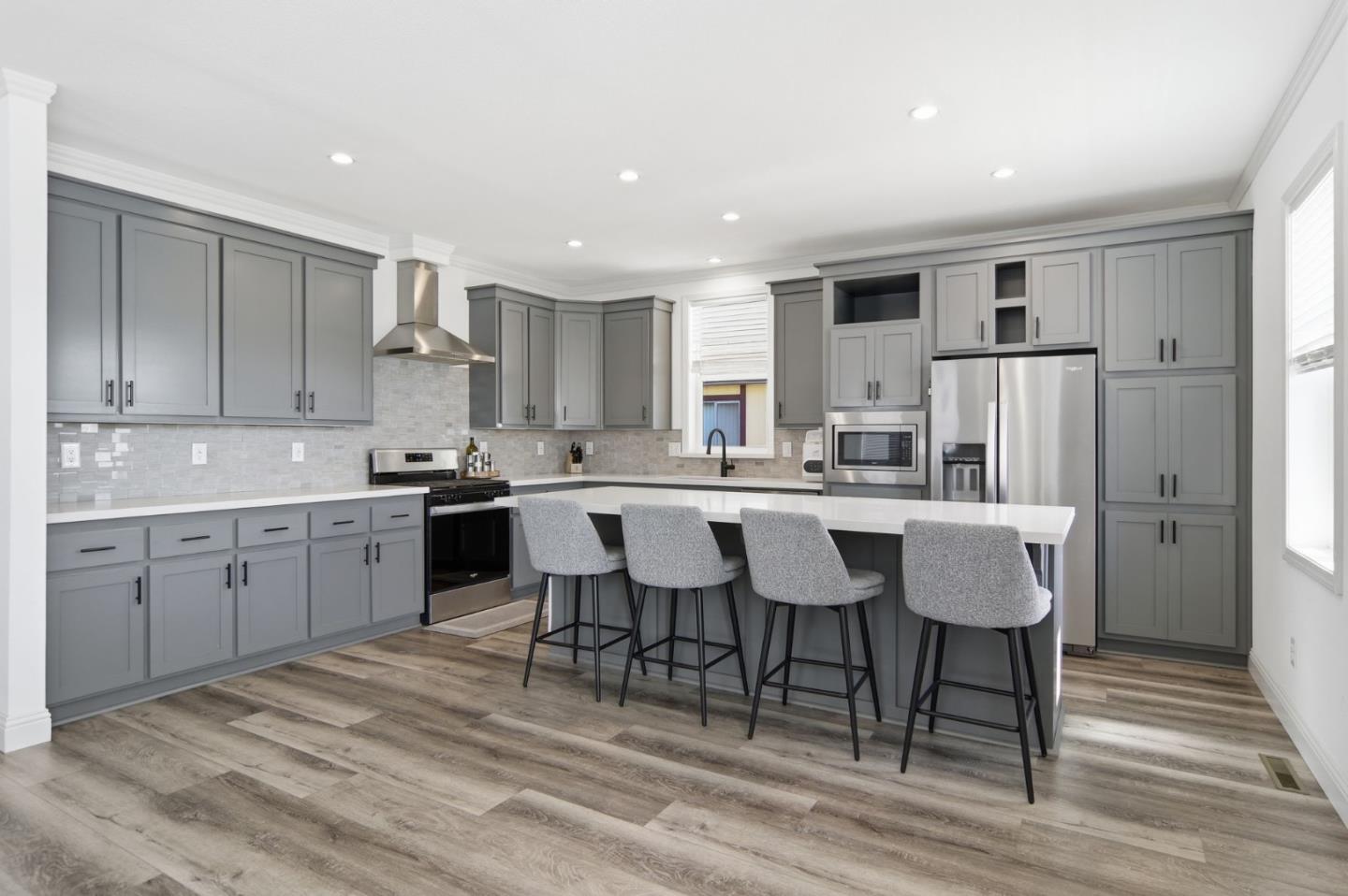 1842 Quimby Road, Unit 1842 San Jose, CA 95122 - Photo 9 of 25 a kitchen with kitchen island granite countertop a sink cabinets and stainless steel appliances
