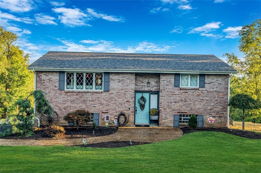 259 Christy Road Eighty Four, PA 15330 - Photo 1 of 46 a front view of a house with a garden