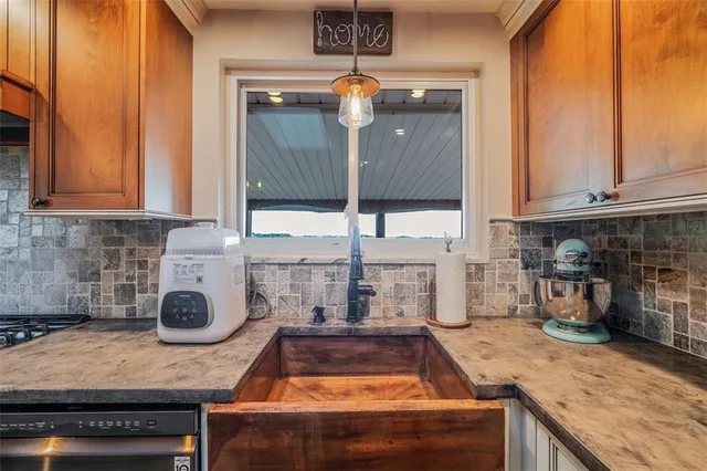 a kitchen with a stove and a cabinets