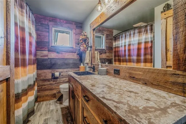 a bedroom with furniture and a rug