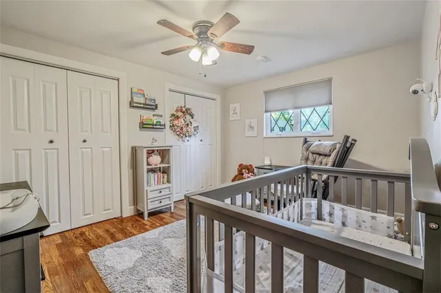 a living room with furniture fireplace and large windows