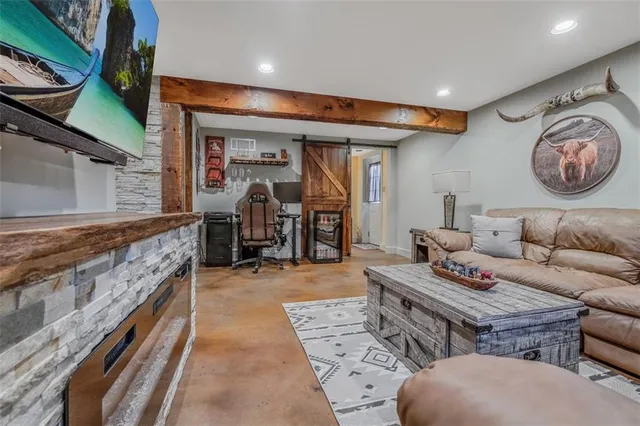 a view of living room with furniture and rug