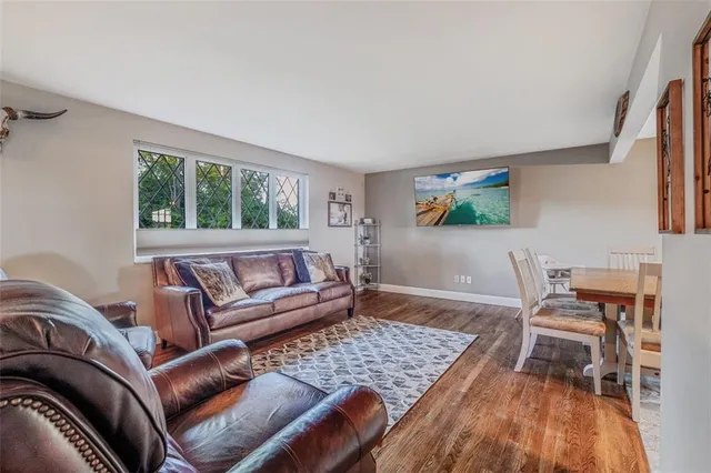 a living room with a couch and a window